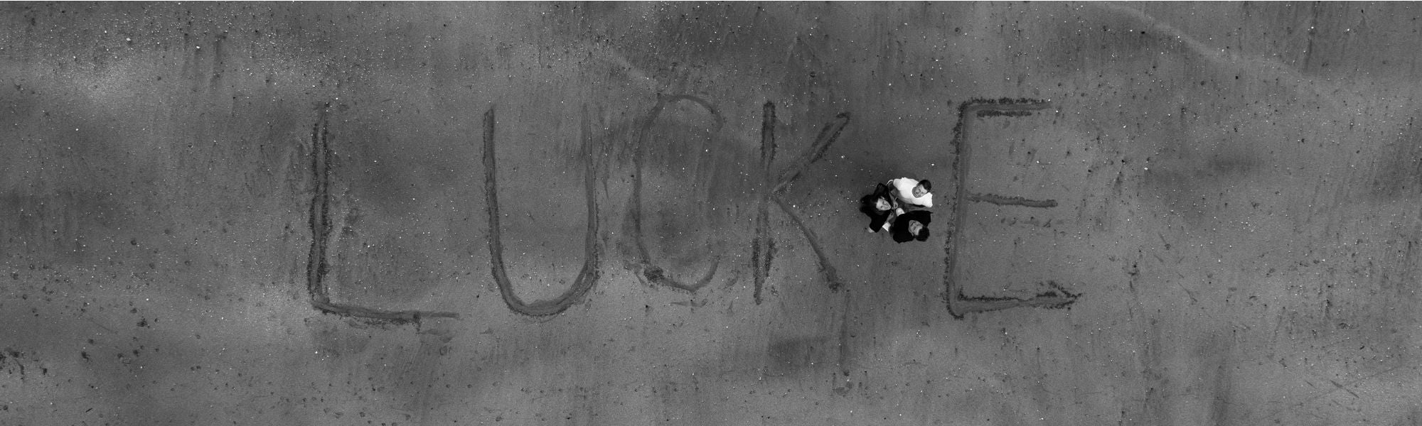 LUCKE written in the sand, from Wilfried’s original profile